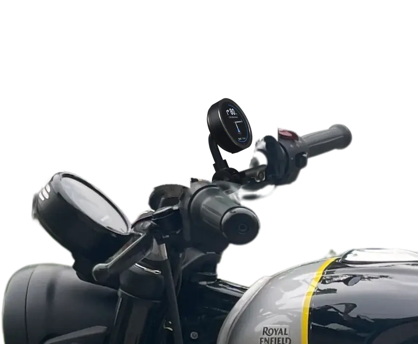 The TRIPX pod clamped on the right half of a motorcycle handlebar, beside the speedometer, showing the next turn.