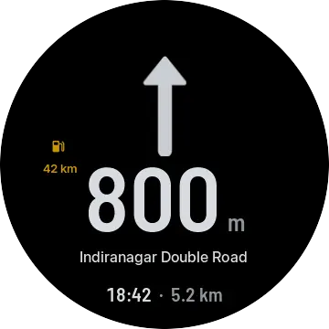 Low fuel: 42 km of range shown in amber beside the next turn.